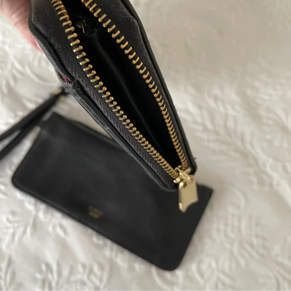 NWOT Tutilo Black wallet with wristlet. Gold hardware. Very nice